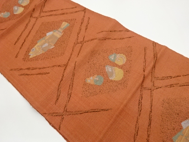 Handwoven tsumugi tsumugi Nagoya obi with fish and abstract pattern woven into i